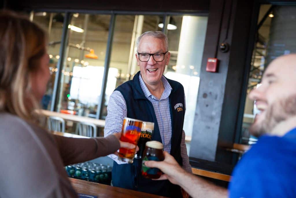 Harpoon Brewery CEO Dan Kenary toasts with employees